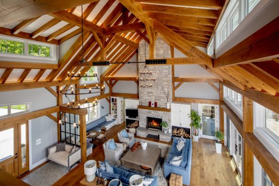 Normerica-Timber-Homes-Timber-Frame-Portfolio-Beachside-Bliss-Interior-View-to-Living-Room-from-Loft-Cathedral-Ceiling-Open-Concept