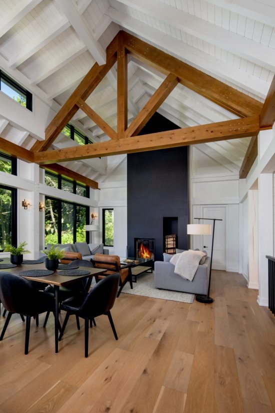 lakeside-cottage-modern-style-bungalow-portfolio-2022-4-monochrome-cool-Normerica-Timber-Frame-cottage-great-hall fireplace-dining-room