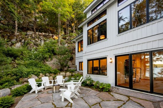 lakeside-cottage-modern-style-bungalow-portfolio-2022-4-monochrome-cool-Normerica-Timber-Frame-cottage-exterior-patio-entertaining