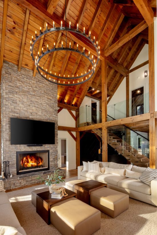 Traditional Lakeside Cottage Lakeside Escape Project Portfolio Interior Great Room Fireplace View to Loft Normerica Timber Homes