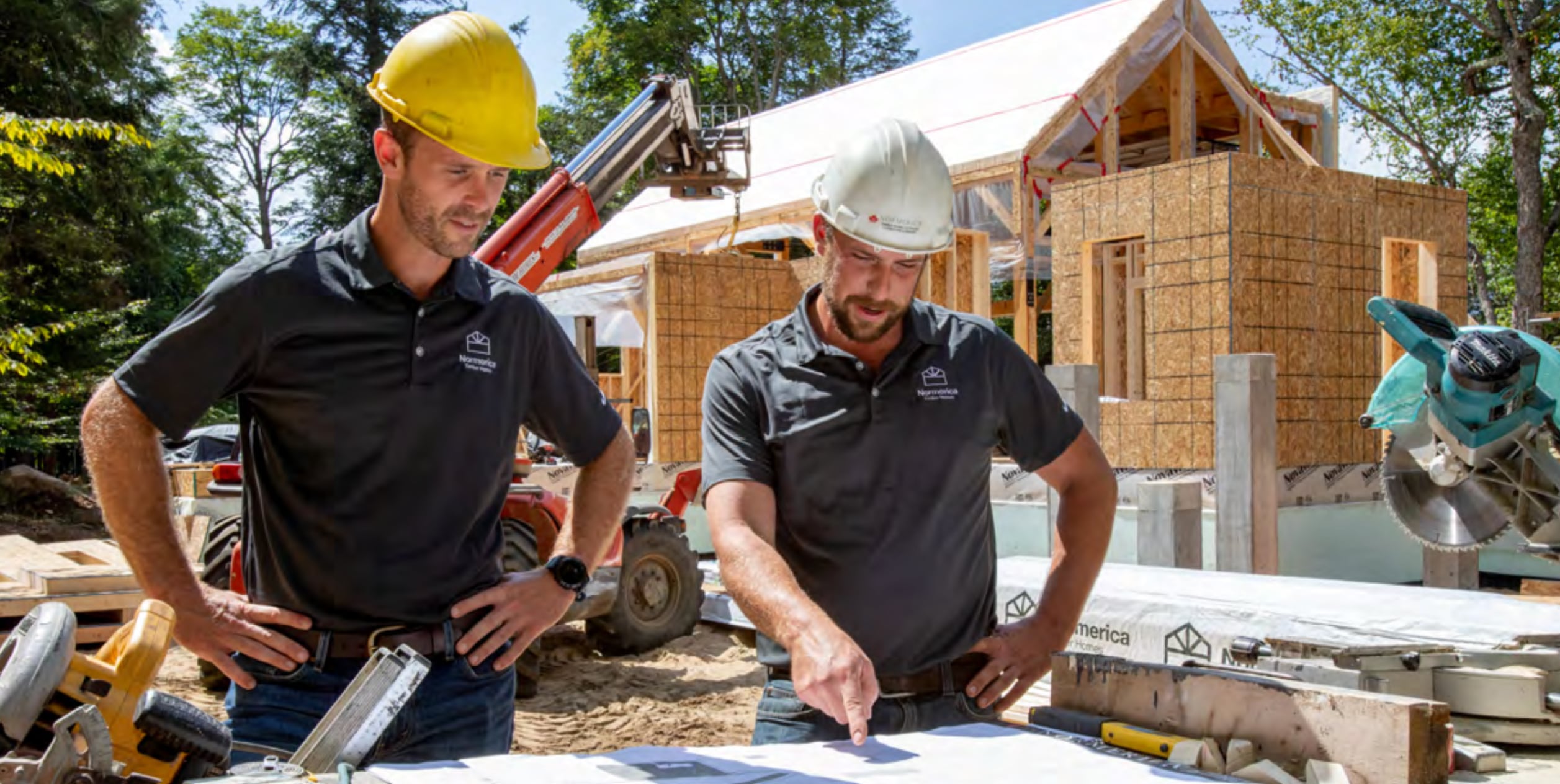  Workers looking at blueprint